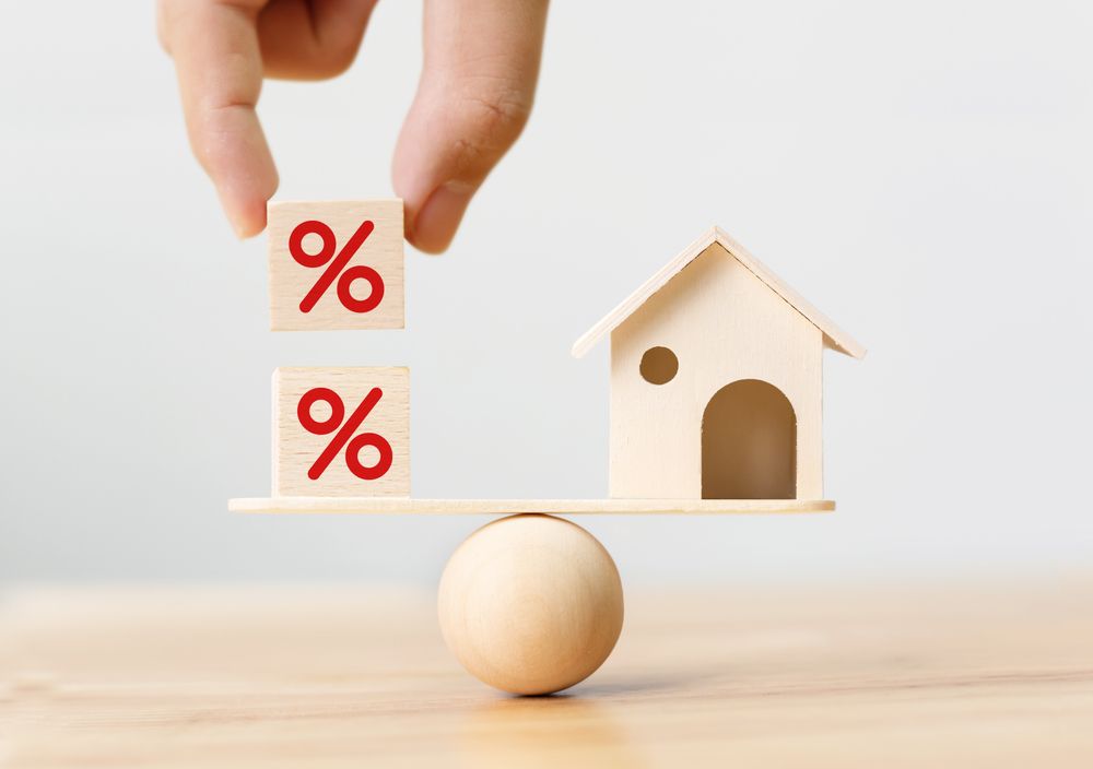 Interest,rate,financial,and,mortgage,rates,concept.,wooden,home,and