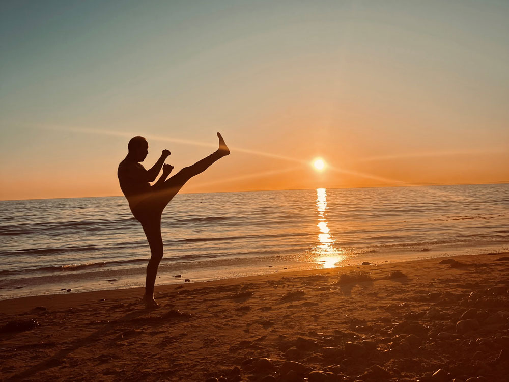 Person kicking on a beach